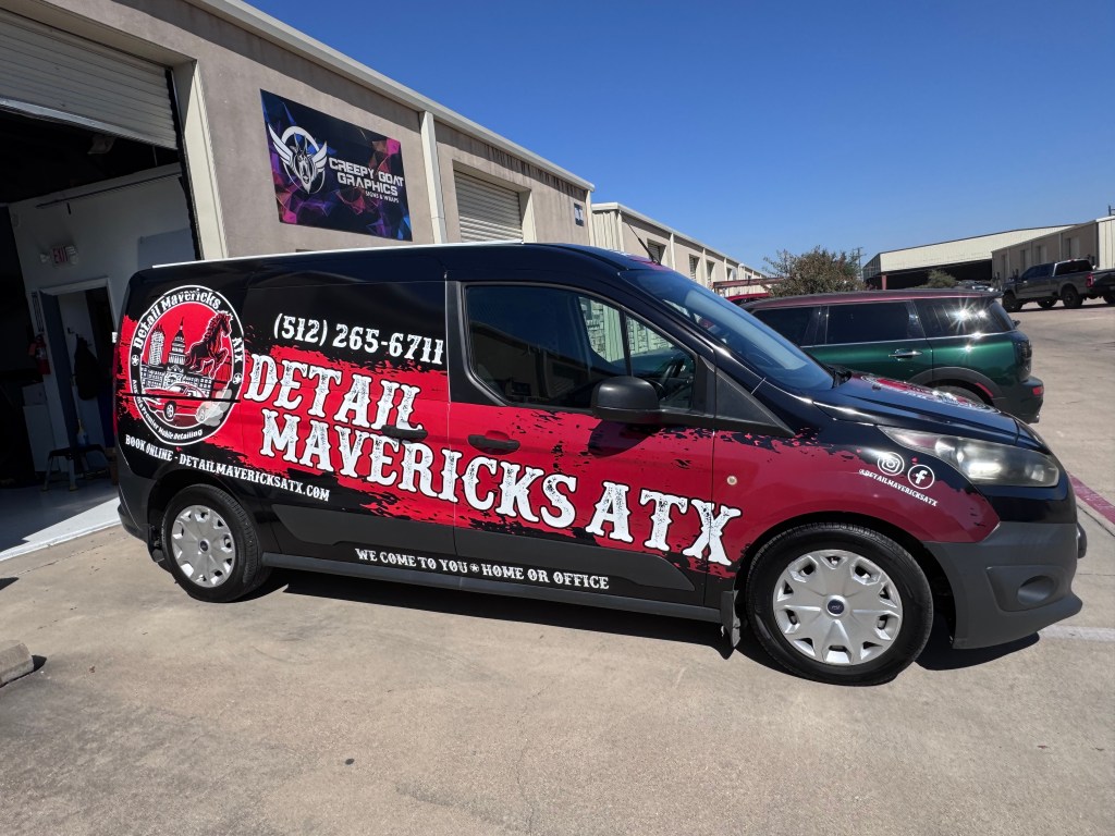 Ford Transit van wrapped for Detail Mavericks Atx,  colors are black base with red streak and logo down the side of the van 